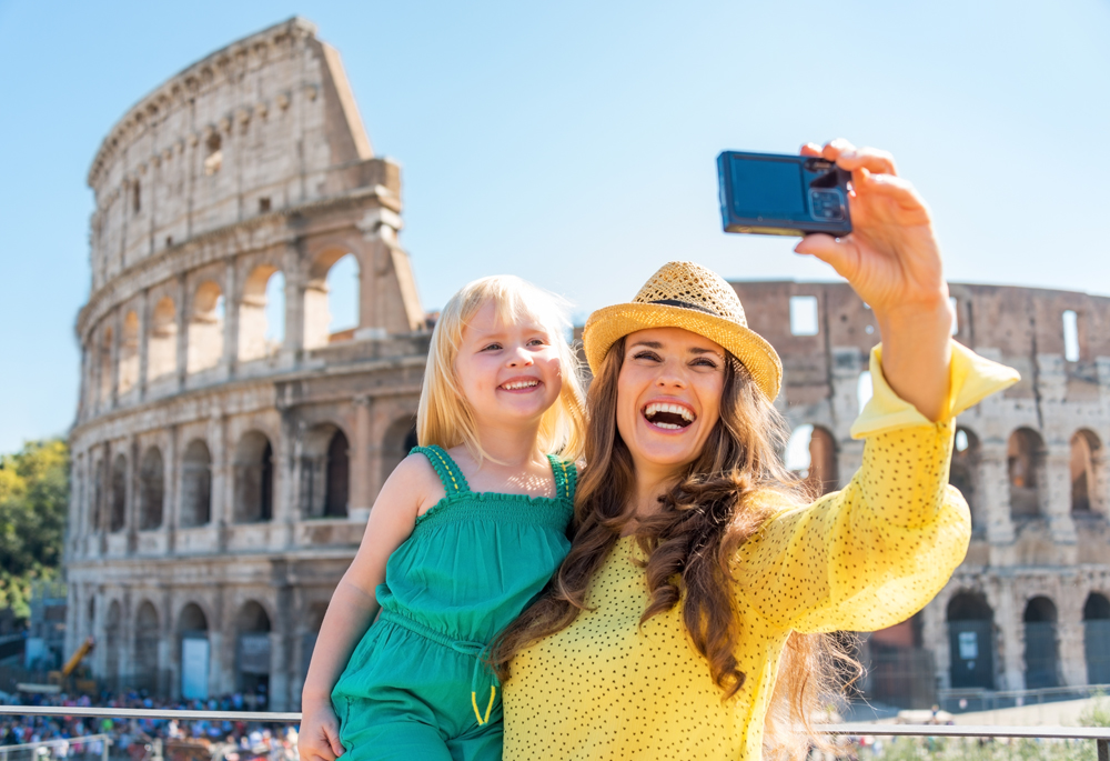 Mother-and-baby-girl-taking-selfie-in-front-of-Colosseum-in-Rome-Italy-_253301299
